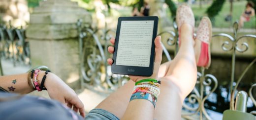 person holding person holding kobo e reader