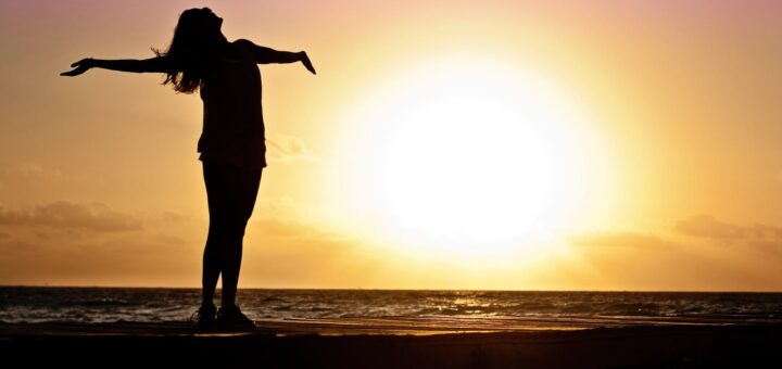 silhouette photo of woman against during golden hour